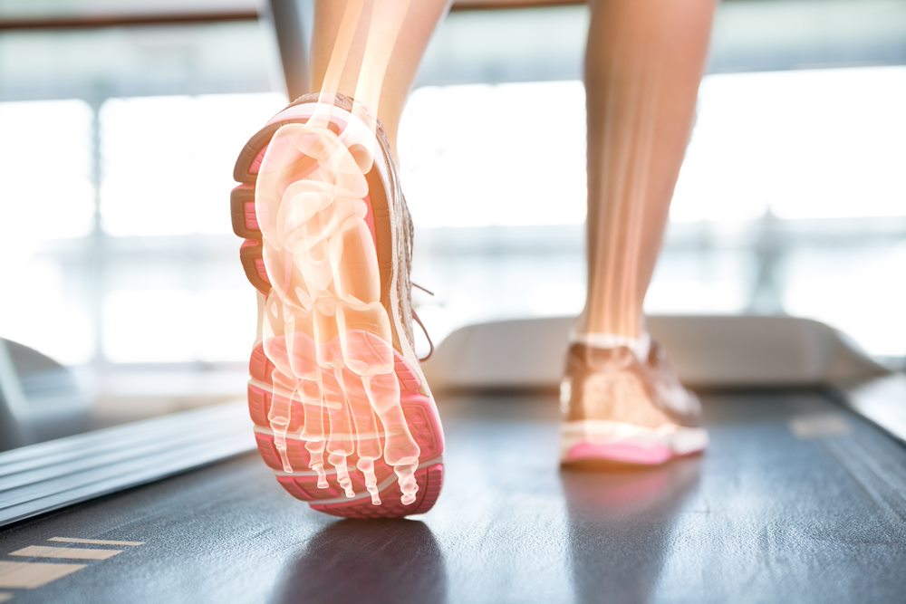 digital composite of highlighted foot of a woman on treadmill